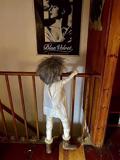Hanging doll inside a wardrobe